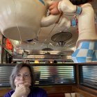 Vintage Café Scene with Thoughtful Man and Woman