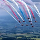 Digital Artwork of Aircraft with Colorful Smoke Trails