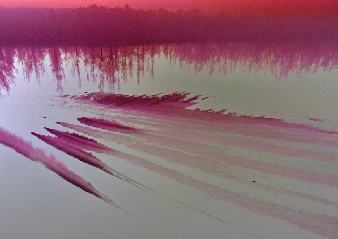 Serene Sunset Over Water with Vibrant Reflections