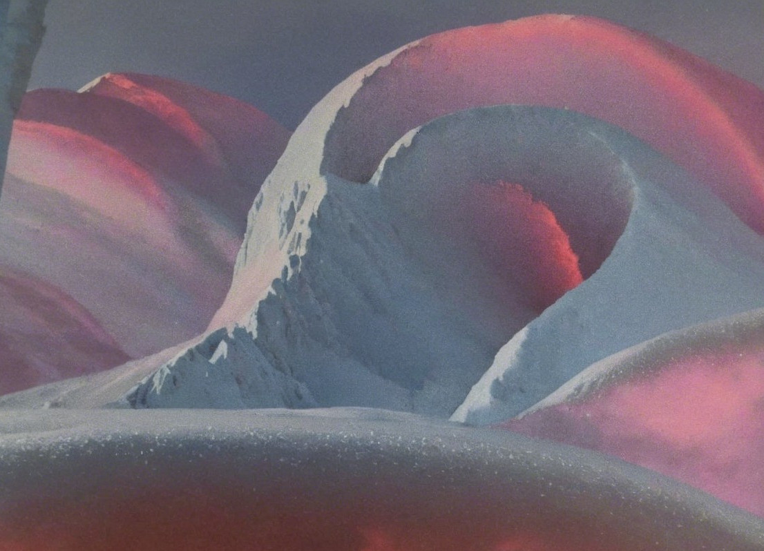 Surreal Landscape of Pink Hills and Blue Peaks