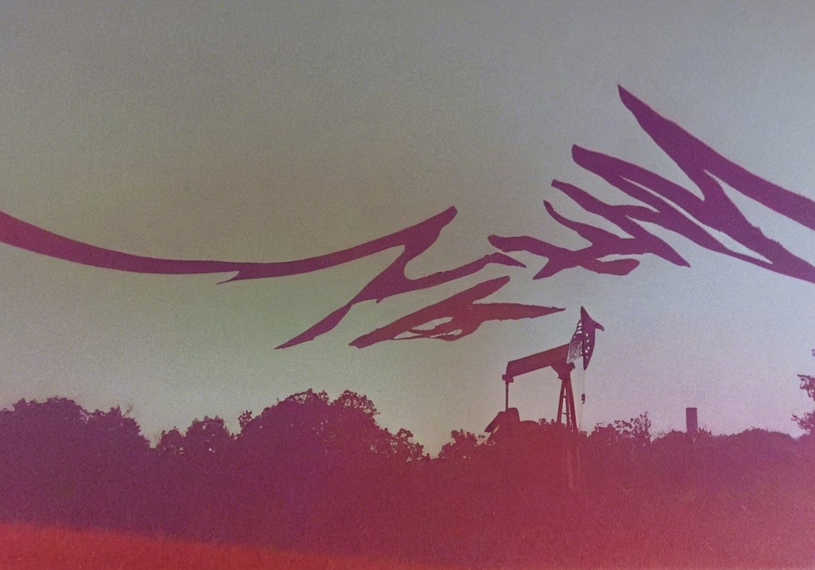 Silhouetted Landscape with Oil Pump Jack and Sky Gradient