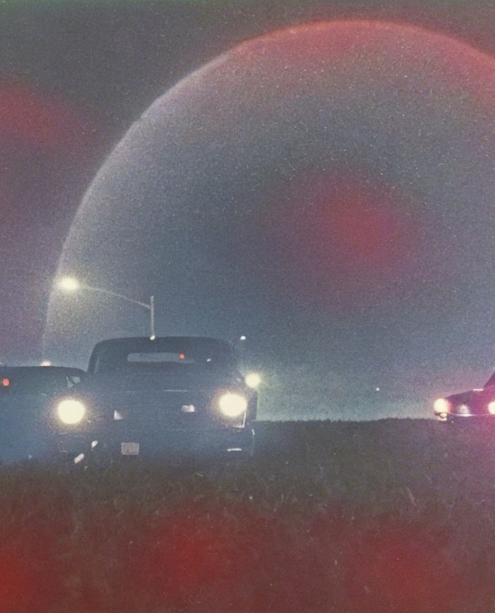 Vintage Cars Under Ethereal Night Sky Halo