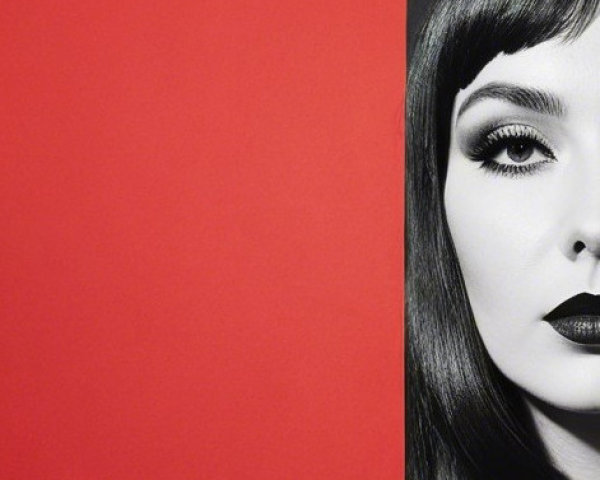 Black-and-White Portrait with Red Background Contrast