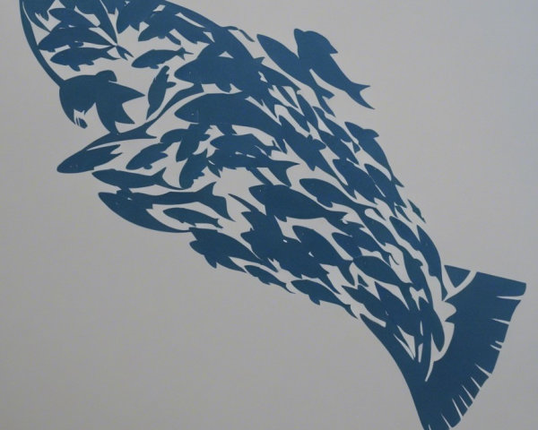 Graphic design of a large fish made of smaller fish