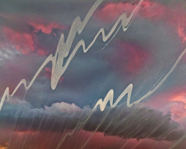 Dramatic Sky with Swirling Clouds and Silver Streaks