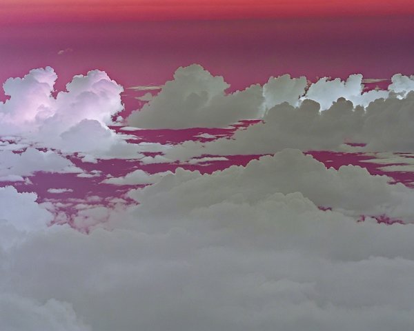 Billowing Clouds in Pink and Purple Sky