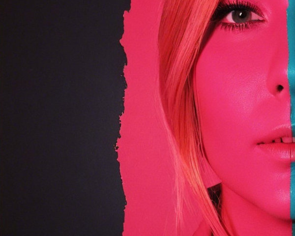 Close-up of a woman's face with vibrant colors and contrast