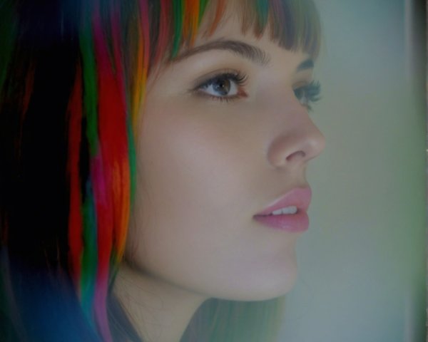 Young Woman with Vibrant Hair in Ethereal Portrait