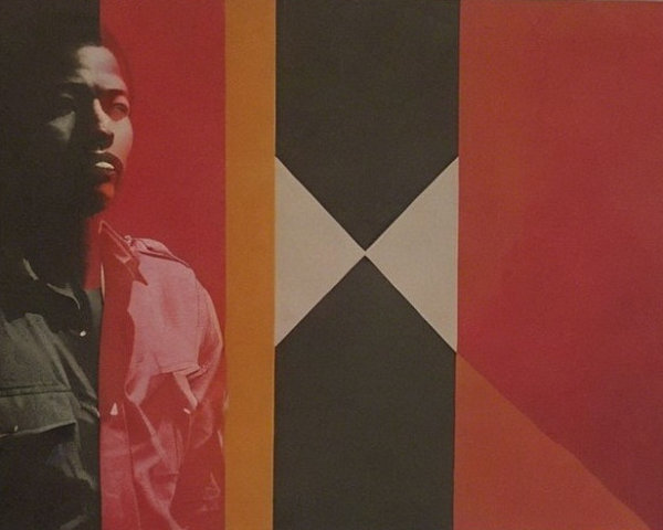 Close-up of a man's face and torso in shadows