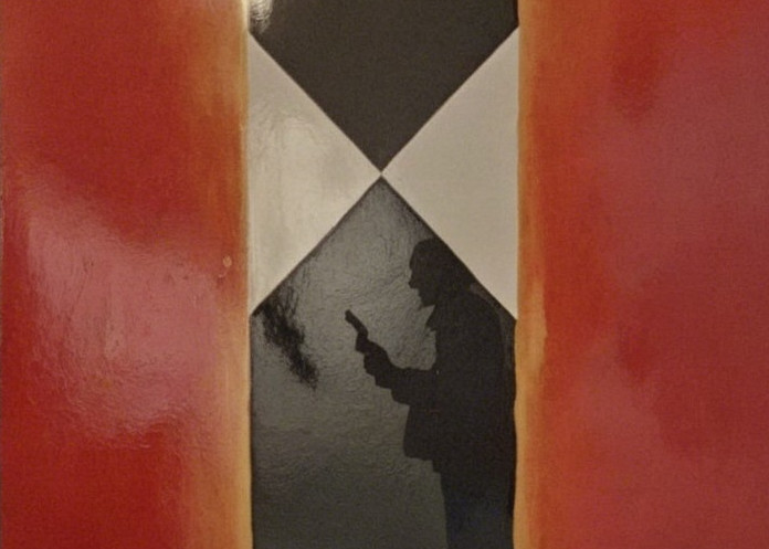 Reddish-Orange Strips Frame Checkered Panel with Figure