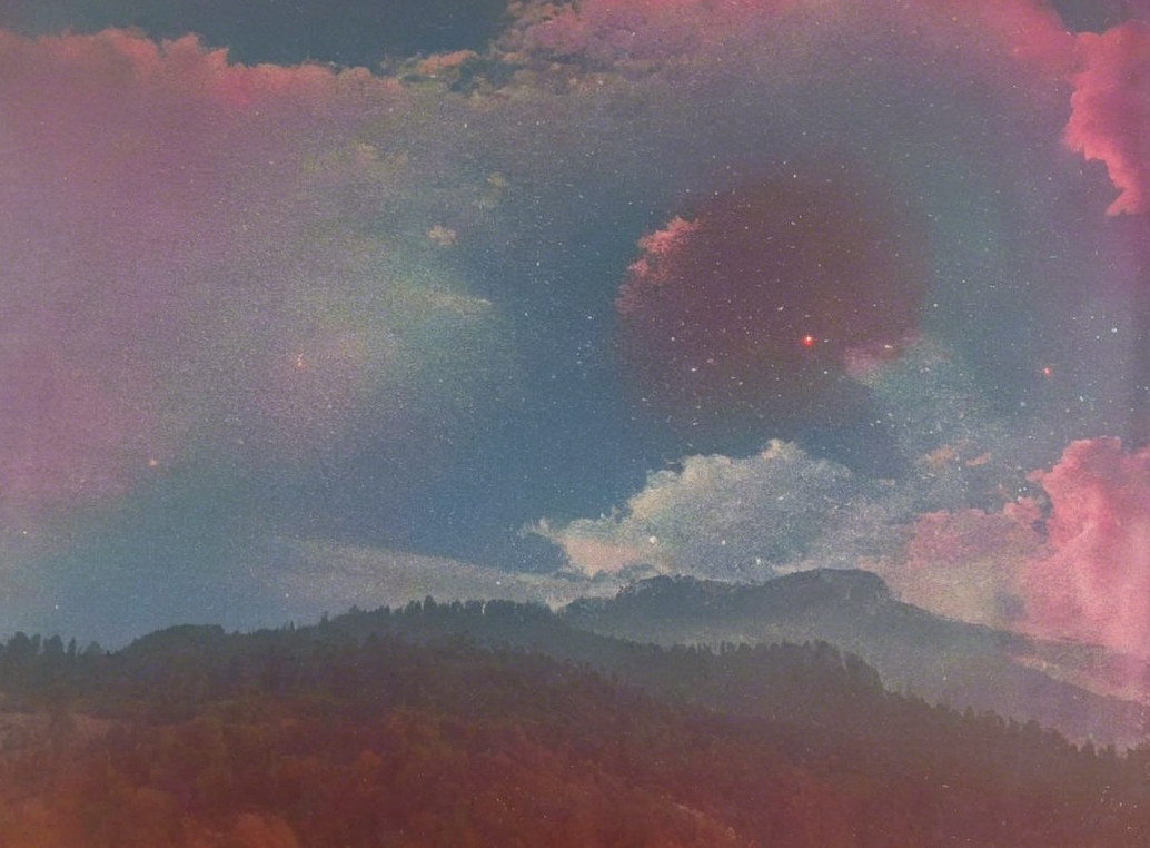Surreal Landscape with Vibrant Sky and Celestial Elements