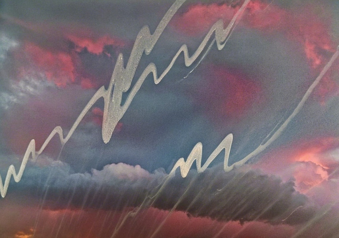 Dramatic Sky with Swirling Clouds and Silver Streaks