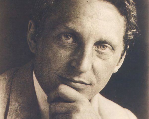 Black-and-white portrait of a thoughtful man in suit