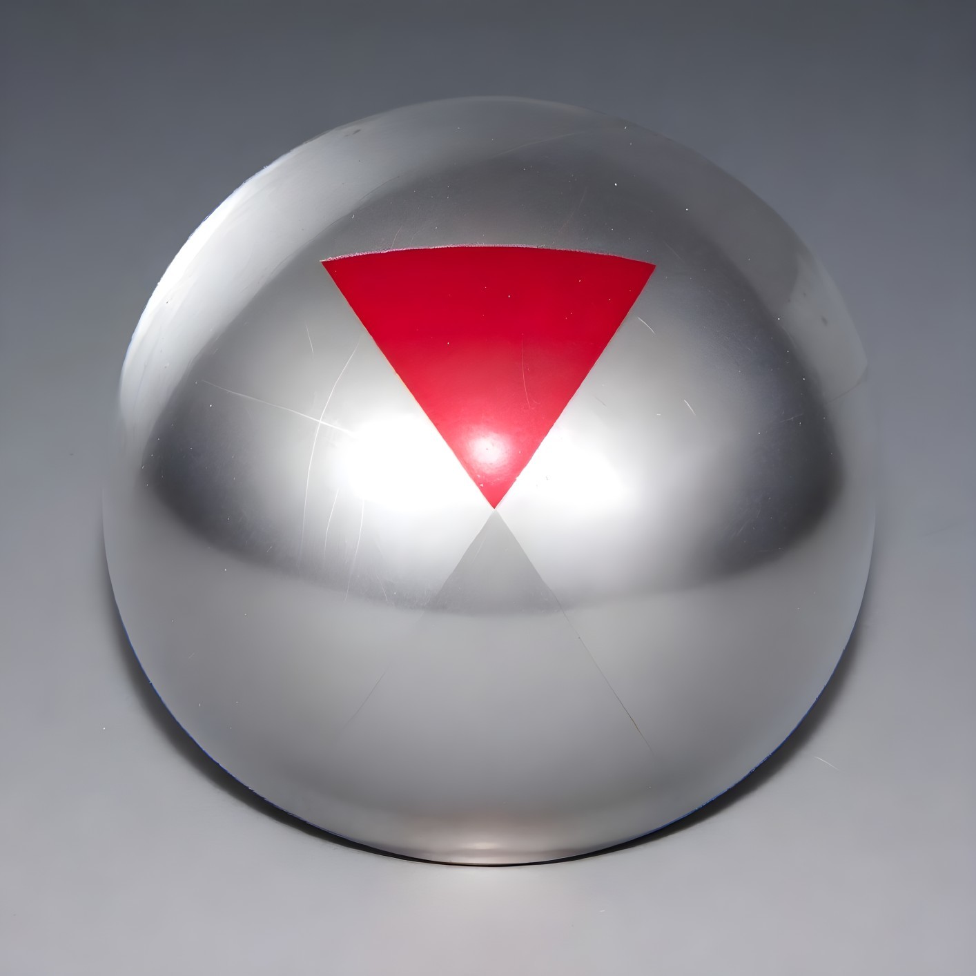 Reflective Silver Sphere with Red Triangular Segment