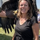 Confident Woman in Black Dress with Majestic Eagle