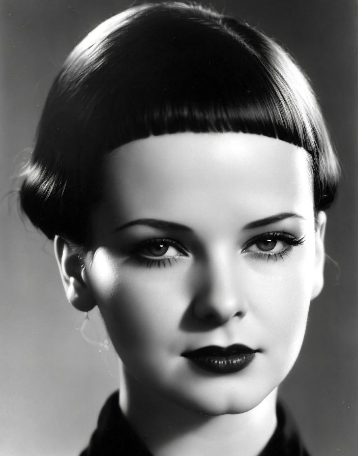 Vintage Black and White Portrait of Woman with Short Hair and Intense Gaze